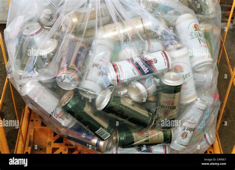 Collection bag full of a supermarket with empty beer cans Stock Photo - Alamy