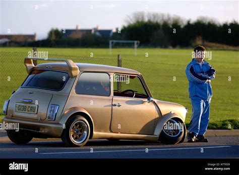 Boy racer style car with broken front wheel Stock Photo: 5351224 - Alamy