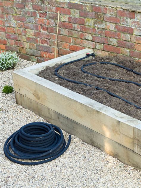 How to Use a Soaker Hose in a Raised Bed Garden - Crate and Basket