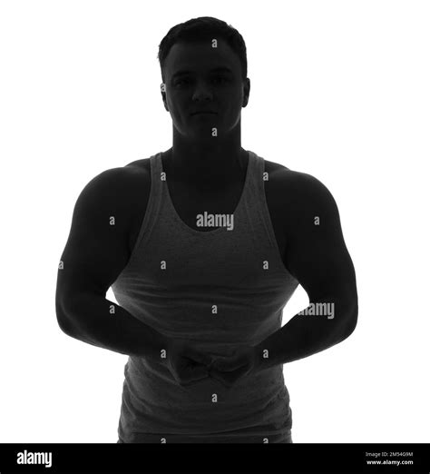 Silhouette Of Sporty Young Man Showing Muscles On White Background