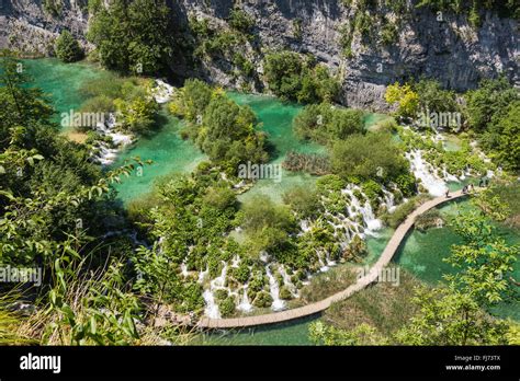 Hike Path Trough The Lake Besides The Waterfall In The Fishes In The