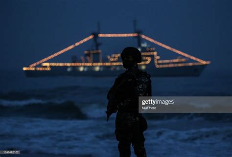 A Sri Lankan Naval Soldier Stands Guard In The Backdrop Of Navy News