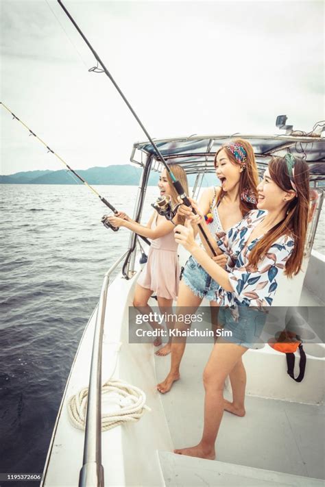 Asian Girls Fishing On A Boat High Res Stock Photo Getty Images