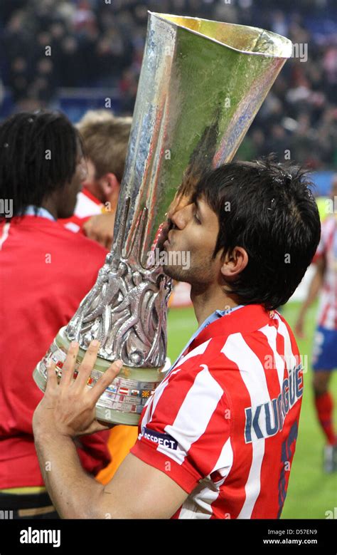 Atletico Madrid Player Sergio Aguero Celebrates With The Trophy After