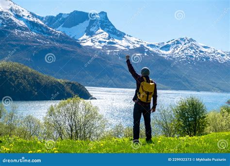 Man Tourist With Standing Of Great Mountain Scandinavia Nature Stock