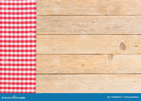 Vintage Red Checked Tablecloth On Wooden Kitchen Table Top Background