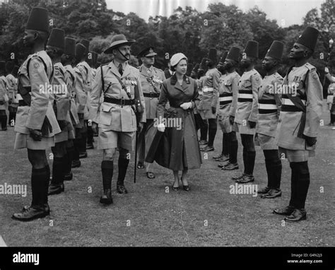 Queen Elizabeth Ii Inspects A Detachment Of The Kings African Rifles