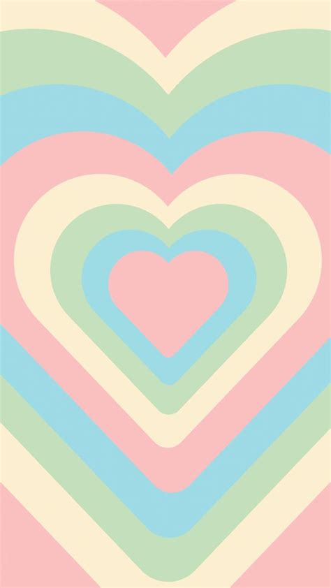 A Heart Shaped Pattern In Pastel Colors On A Pink Blue And Green