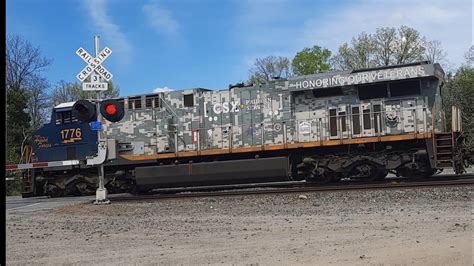 The CSX Spirit Of Armed Forces Leads Intermodal Train And Work Train At