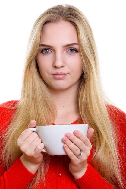 Cara de joven hermosa adolescente sosteniendo la taza de café Foto