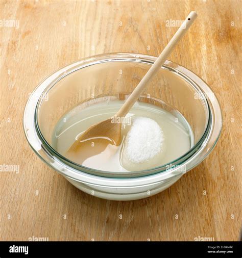 Sugar Dissolving In A Bowl Of Water Stock Photo Alamy