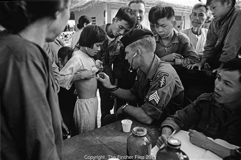 Us Medic Of The Green Berets Seen Helping Villagers From The