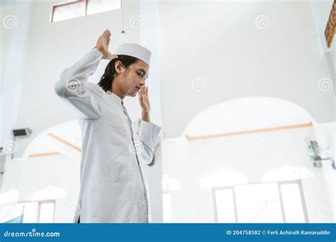 Muslim Man Doing Sujud Or Sajdah On The Glass Floor Royalty Free Stock