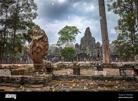 A Giant Naga On A Stone Balustrade By An Entrance To The Ruins Of The