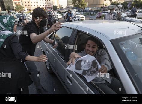 A Supporter Of Presidential Elections Candidate Ebrahim Raisi Smiles As