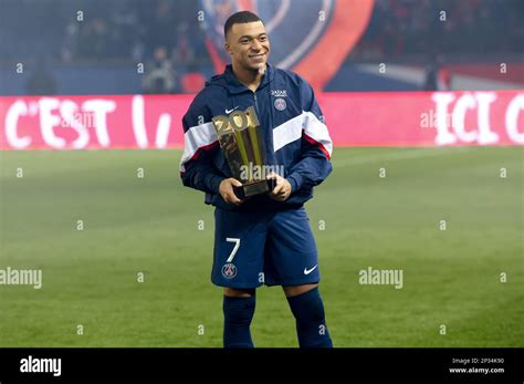 Kylian Mbappe Of PSG Receives A Trophy Celebrating His 201st Goal For