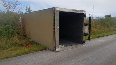 Car Crash Flips Box Truck Sends Three People To Hospitals