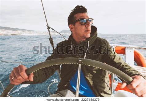 Men Driving Boat Over 7256 Royalty Free Licensable Stock Photos