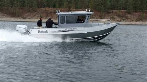 two men on a motor boat in the water