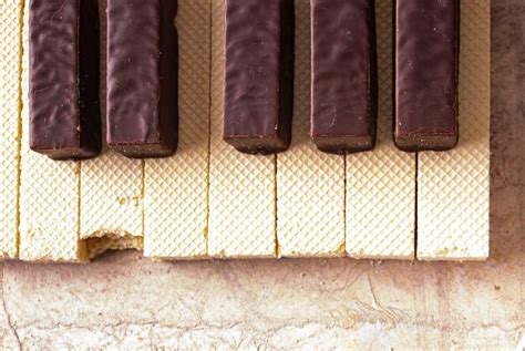 Premium Photo Piano Keyboard Lined With Waffles And Chocolate