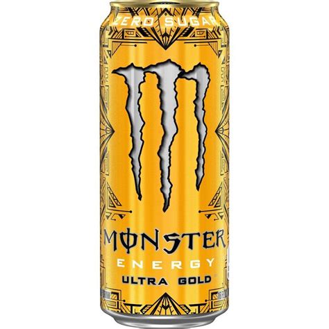 The Monster Energy Drink Is Yellow And Has Two Large White Teeth On It