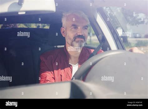 Mature Man Driving Car Seen Through Windshield Stock Photo Alamy