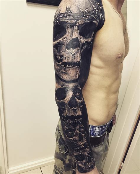 Skulls On Guys Arm