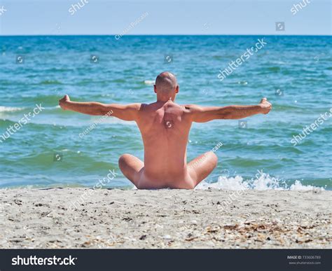 Naked Man Sitting On Empty Beach Stock Photo Shutterstock