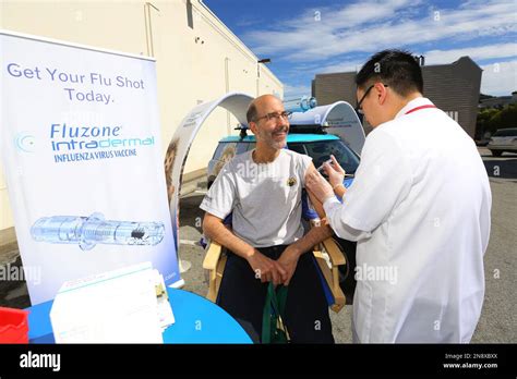 Steve Blumenthal Is Given Fluzone® Shot By Pharmacist Kelvin Kwok At