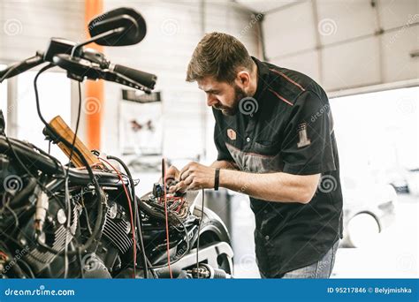 Motorcycle Mechanic Repairing Electronics Sports Black Bike Stock