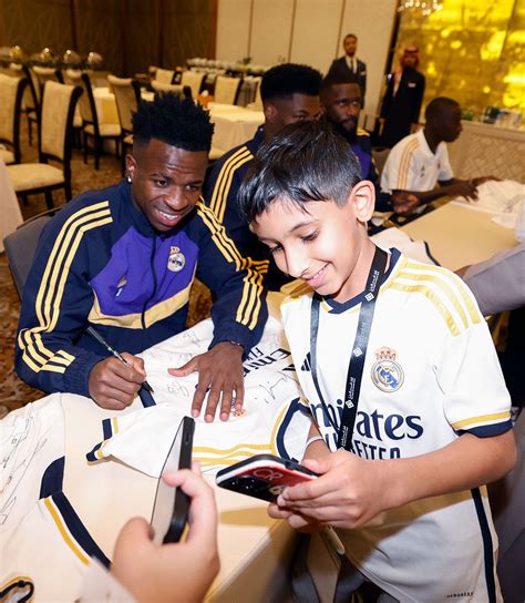 Real Madrid Stars Engage With Fans Signing Autographs And Posing For