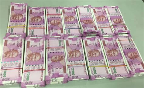 Bengaluru Rs 2 25 Crore In New Rs 2 000 Notes Guarded By Elderly Woman