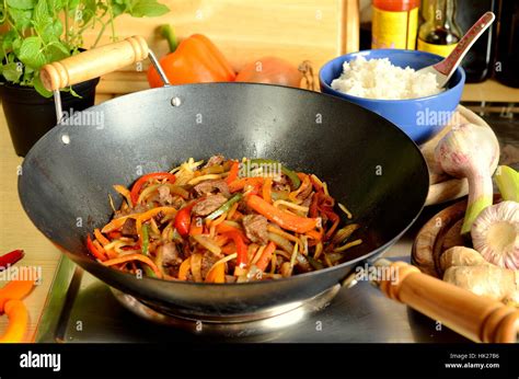 asian cooking in a wok Stock Photo - Alamy