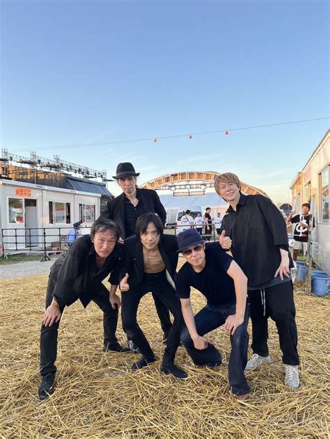 Five People Posing For A Photo In Hay