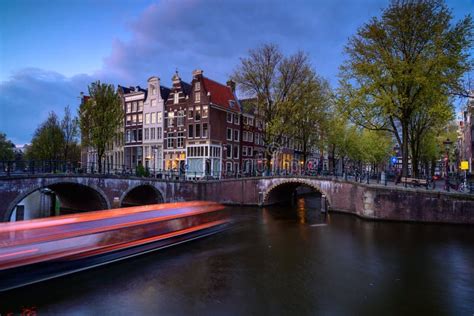 Amsterdam by Night with Floating Boats on the River Canal , Evening ...