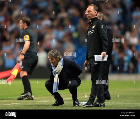 Manchester City S Manager Roberto Mancini Shouts At His Team Alongside