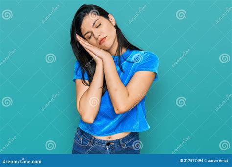 Young Hispanic Woman Wearing Casual Clothes Sleeping Tired Dreaming And