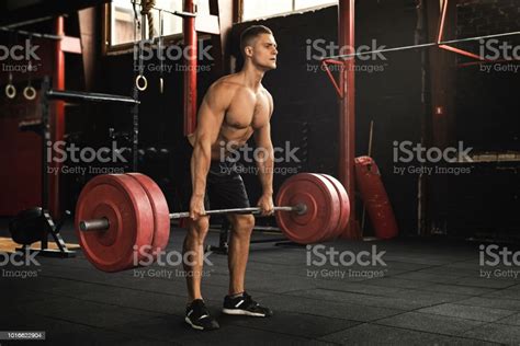 Deadlift Exercise Man During His Workout In The Gym Stock Photo