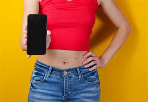 Premium Photo Woman Holding A Smartphone In Her Hand