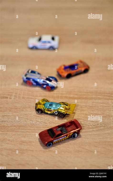 A Vertical Closeup Of Mattel Hot Wheels Toy Model Cars On A Wooden Surface Stock Photo Alamy
