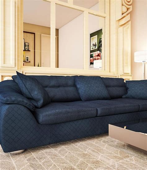 Premium Photo | A blue couch with a pillow on it in a living room.