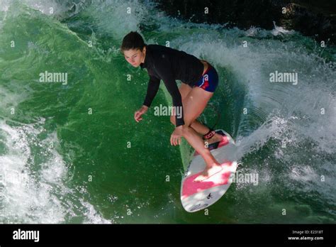 Female Surfer On The Eisbach Wave River Isar English Garden Munich