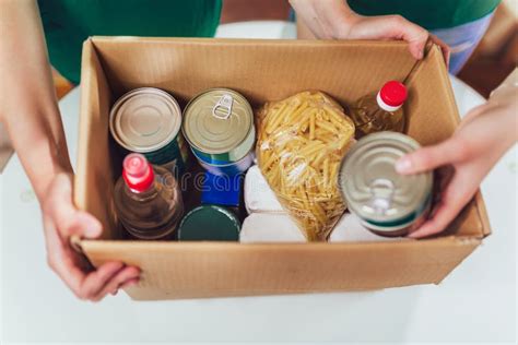 Volunteer With Box Of Food For Poor Donation Concept Stock Image