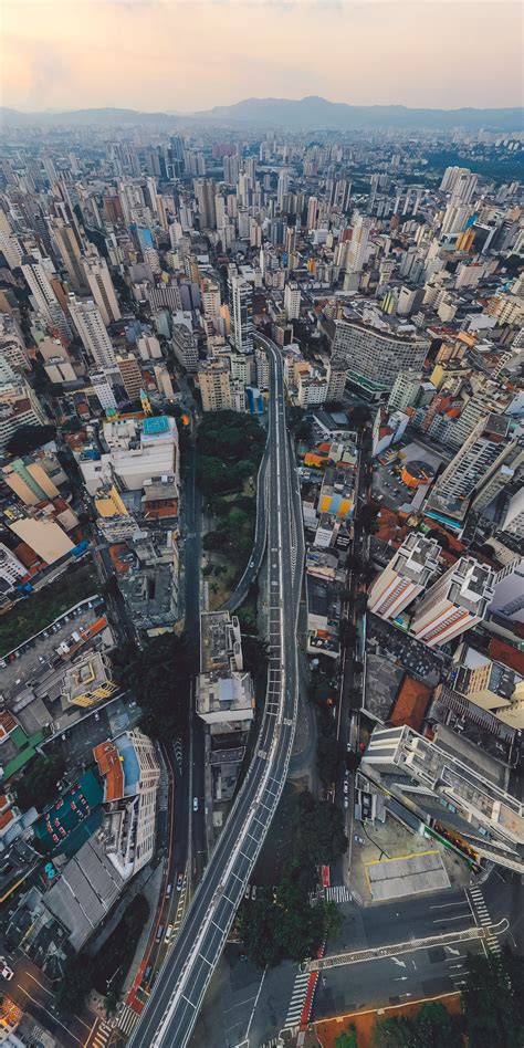 Cityscape with road between buildings · Free Stock Photo