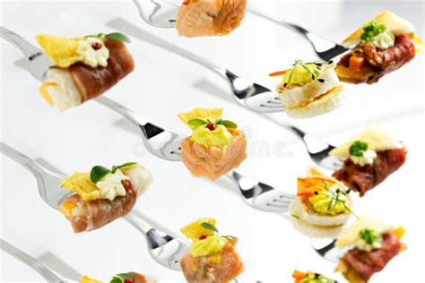 Background Of Mixed Canapes On Metal Forks White Background Stock