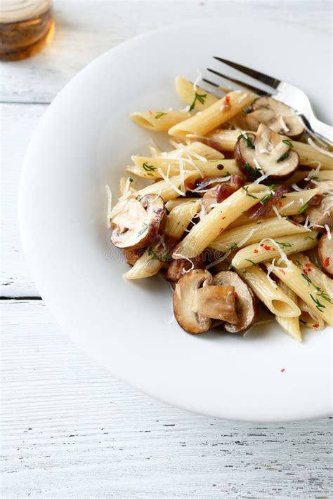 Penne pasta with mushrooms stock photo. Image of meal - 44887262