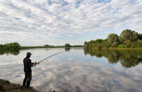 Fishing In River Featuring Outdoor Coast And Leisure Nature Stock