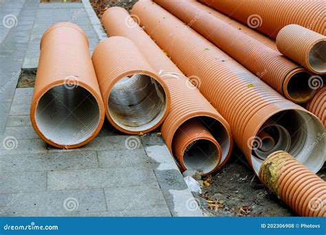 Plastic Pvc Pipes Stacked In Rows At A Construction Site On