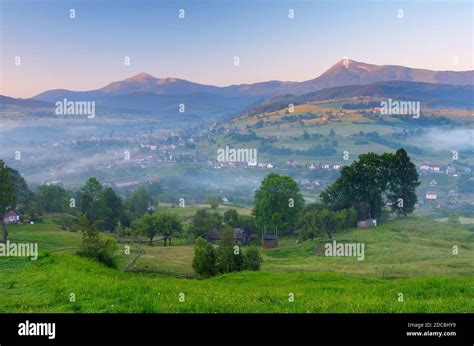 Summer Landscape With Fog Over Mountain Village Stock Photo Alamy