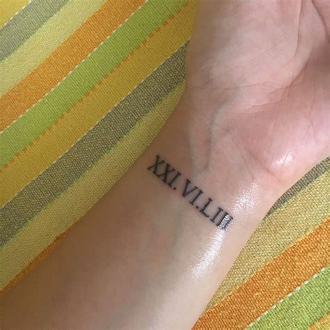 Roman Numerals Tattoo Wrist